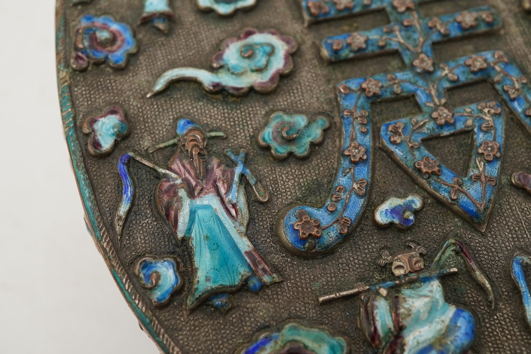 A Chinese silver plated and enamel ‘eight immortals’ oval box, late 19th century